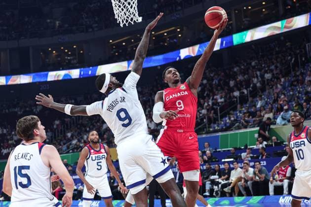 (230910) -- MANILA, Sept. 10, 2023 -- RJ Barrett (top R) of Canada goes for a lay-up during the 3rd place game between the United States and Canada at the 2023 FIBA World Cup in Manila, the Philippines, Sept. 10, 2023. ) (SP)PHILIPPINES-MANILA-BASKETBALL-FIBA WORLD CUP-3RD PLACE GAME-USA VS CAN WuxZhuang 