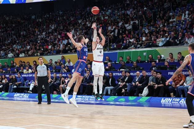 (230910) -- MANILA, Sept. 10, 2023 -- Andreas Obst (R) of Germany shoots during the final between Germany and Serbia at the 2023 FIBA World Cup in Manila, the Philippines, Sept. 10, 2023. ) (SP)PHILIPPINES-MANILA-BASKETBALL-FIBA WORLD CUP-FINAL-GER VS SRB WuxZhuang 