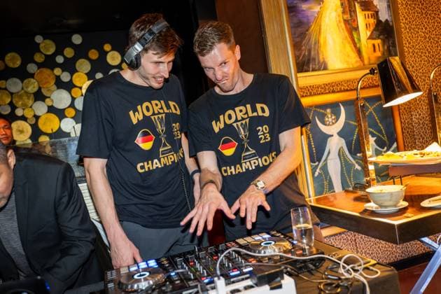 Basketball Manila Pasay 11 09 2023 FIBA Basketball World Cup 2023 Mens World Cup Final Germany GER Serbia SRB Germany is World Champion Party after the game at night at The Peninsula Manila Hotel David Krämer Germany, No 44 Kraemer Kramer as DJ on the turntables Andreas Obst Germany, No 42 re