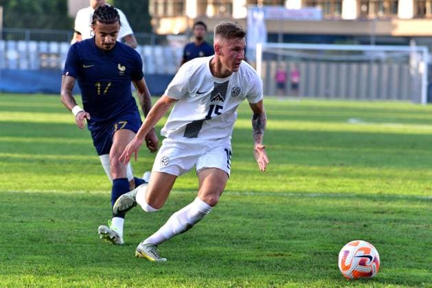 Malo Gusto of France (L) in action against Mark Strajnar of Slovenia (R) during the 2025 UEFA European Under-21 Championship Qualification football match Group H between Slovenia and France FOOTBALL : SlovÃ nie vs France - Championnat d Europe des moins de 21 ans UEFA - Match de qualification Groupe H - 11 09 2023 IgorKupljenik Panoramic 