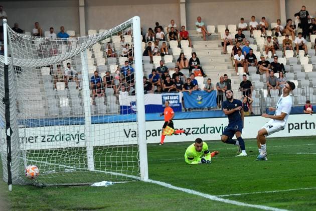Rayan Cherki of France (R) in action against Martin Turk of Slovenia (L) during the 2025 UEFA European Under-21 Championship Qualification football match Group H between Slovenia and France FOOTBALL : SlovÃ nie vs France - Championnat d Europe des moins de 21 ans UEFA - Match de qualification Groupe H - 11 09 2023 NatasaKupljenik Panoramic 
