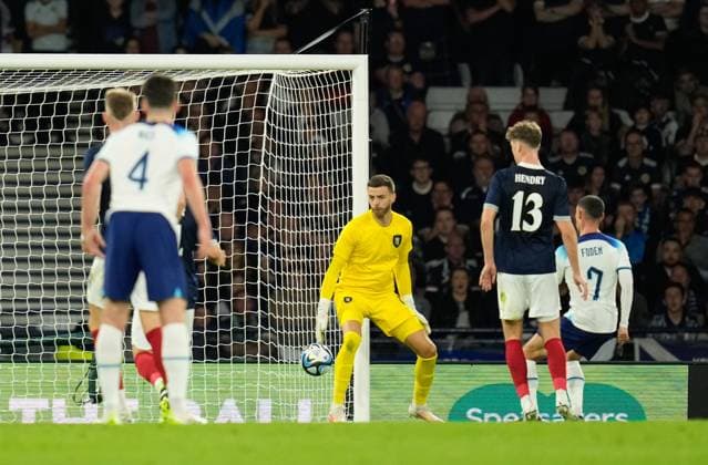 Mandatory Credit: Photo by Stuart Wallace Shutterstock (14094533m) Phil Foden of England scores past Scotland goalkeeper Angus Gunn to give England a 0-1 lead. Scotland v England, International Friendly, Länderspiel, Nationalmannschaft Football, Hampden Park, Glasgow, UK - 12 Sep 2023 EDITORIAL USE ONLY No use with unauthorised audio, video, data, fixture lists, club league logos or live services. Online in-match use limited to 120 images, no video emulation. No use in betting, games or single club league player publications. Scotland v England, International Friendly, Football, Hampden Park, Glasgow, UK - 12 Sep 2023 EDITORIAL USE ONLY No use with unauthorised audio, video, data, fixture lists, club league logos or live services. Online in-match use limited to 120 images, no video emulation. No use in betting, games or single club league player publications. Copyright: xStuartxWallace Shutterstockx 14094533m