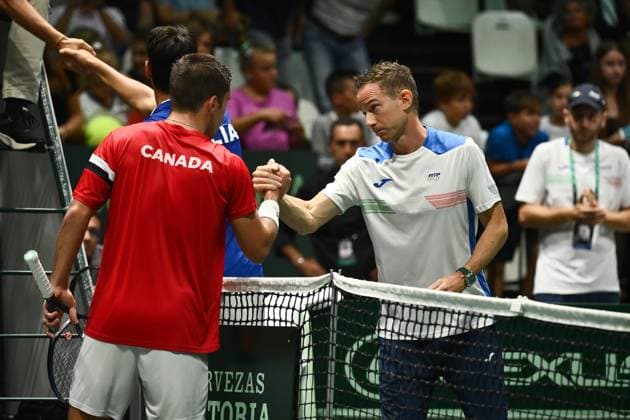 Foto Massimo Paolone LaPresse 13 Settembre 2023 - Bologna, Italia - tennis - Canada vs Italia - Alexis Galarneau (CAN) v Lorenzo Sonego (ITA) - Coppa Davis 2023 - Unipol Arena. Nella foto: Filippo Volandri si congratula con Alexis Galarneau per la vittoria September 13, 2023 Bologna, Italy - sport, tennis - Canada vs Italy - Alexis Galarneau (CAN) v Lorenzo Sonego (ITA) - Davis Cup 2023 - Unipol Arena. In the pic: Filippo Volandri congratulates Alexis Galarneau on the victory  Copyright: xMassimoxPaolone LaPressex