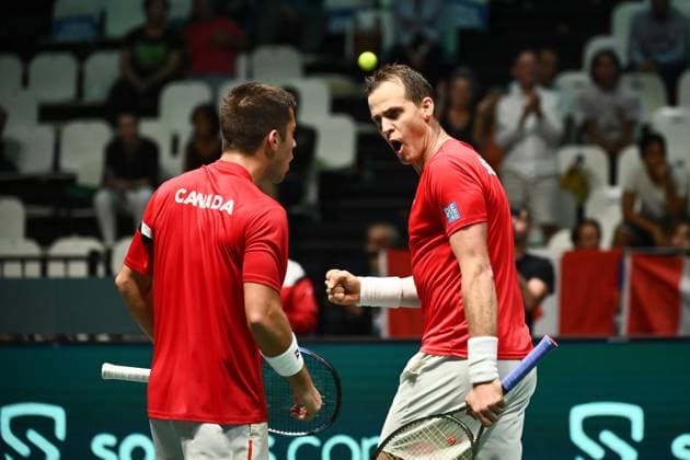 Foto Massimo Paolone LaPresse 13 Settembre 2023 - Bologna, Italia - tennis - Canada vs Italia - Alexis Galarneau Vasek Pospisil (CAN) v Simone Bolelli Matteo Arnaldi (ITA) - Coppa Davis 2023 - Unipol Arena. Nella foto: Alexis Galarneau, Vasek Pospisil, Frank Dancevic esultano September 13, 2023 Bologna, Italy - sport, tennis - Canada vs Italy - Alexis Galarneau Vasek Pospisil (CAN) v Simone Bolelli Matteo Arnaldi (ITA) - Davis Cup 2023 - Unipol Arena. In the pic: Alexis Galarneau, Vasek Pospisil, Frank Dancevic celebrate  Copyright: xMassimoxPaolone LaPressex