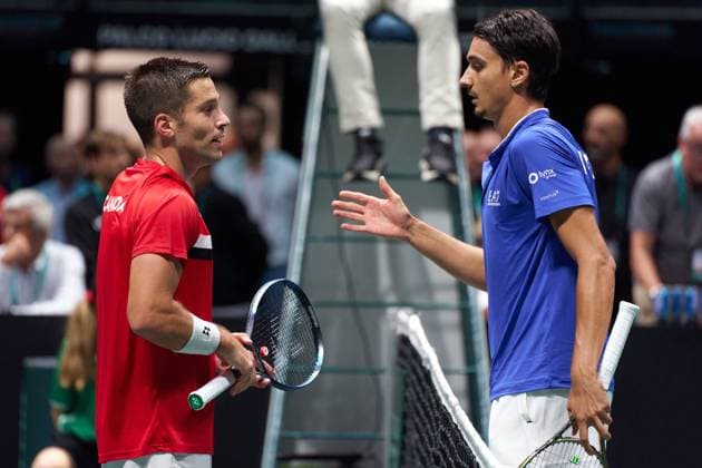 Lorenzo Sonego of Italy and Alexis Galarneau of Canada at the net after the Davis Cup Group Stage 2023 Bologna match between Italy and Canada at Unipol Arena on September 13, 2023 in Bologna, Italy. (Photo by Camilla Stolen Imago) Bologna ITALY Copyright: xCamillaxStolenx L1360415
