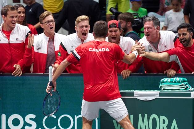 Alexis Galarneau of Canada celebrates with the Canadian team after his win to Lorenzo Sonego of Italy during the Davis Cup Group Stage 2023 Bologna match between Italy and Canada at Unipol Arena on September 13, 2023 in Bologna, Italy. (Photo by Camilla Stolen Imago) Bologna ITALY Copyright: xCamillaxStolenx L1360421