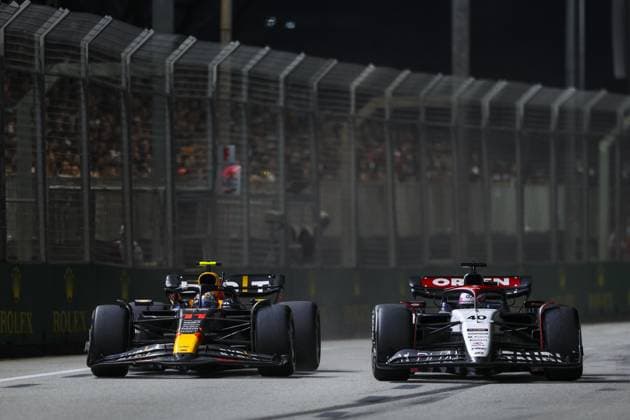 11 PEREZ Sergio (mex), Red Bull Racing RB19, 40 LAWSON Liam (nzl), Red Bull Racing RB19, action during the 2023 Formula 1 Singapore Airlines Singapore Grand Prix, 15th round of the 2023 Formula One World Championship, WM, Weltmeisterschaft from September 15 to 17, 2023 on the Marina Bay Street Circuit, in Singapore - F1 - SINGAPORE GRAND PRIX 2023 - RACE DPPI Panoramic  G0OD1009