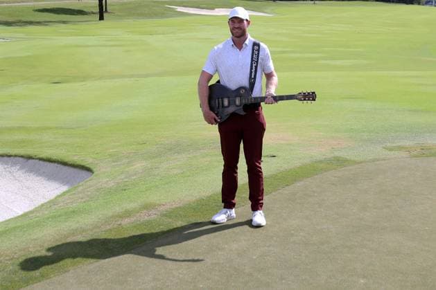COLLEGE GROVE, TN - SEPTEMBER 17: Grayson Murray holds the championship trophy guitar following the final round of the Korn Ferry Tour Finals Simmons Bank Open, September 17, 2023 at The Grove in College Grove, Tennessee. (Photo by Matthew Maxey Icon Sportswire) GOLF: SEP 17 Simmons Bank Open EDITORIAL USE ONLY Icon23091731