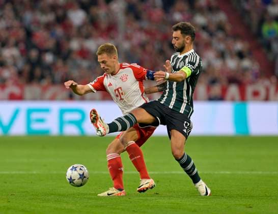 20 09 2023, Football UEFA Championsleague 2023 2024 1 matchday preliminary round, FC Bayern Munich Manchester United, at Allianz Arena Munich v l Joshua Kimmich FC Bayern Munich vs Bruno Fernandes Manchester United DFL and DFB regulations prohibit any use of photographs as image sequences and or quasi video