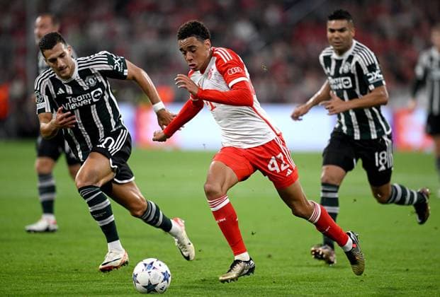 FOOTBALL CHAMPIONS LEAGUE SEASON 2023 2024 Preliminary Round Group A 1 Matchday FC Bayern Muenchen Manchester United FC 20 09 2023 Diogo Dalot left, Manchester United FC vs Jamal Musiala right, FC Bayern Muenchen