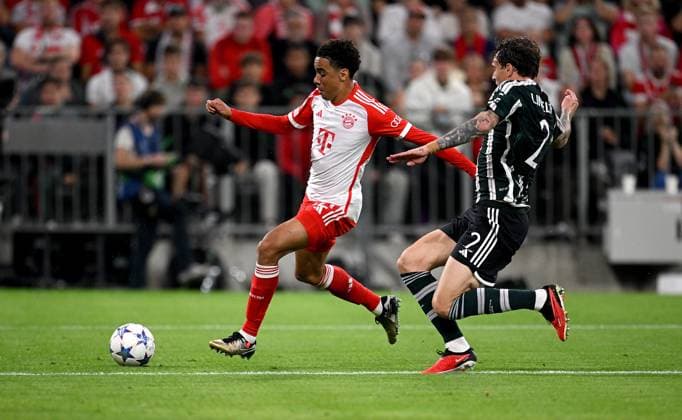 FOOTBALL CHAMPIONS LEAGUE SEASON 2023 2024 Preliminary Round Group A 1 Matchday FC Bayern Muenchen Manchester United FC 20 09 2023 Jamal Musiala left, FC Bayern Muenchen vs Victor Lindeloef right, Manchester United FC
