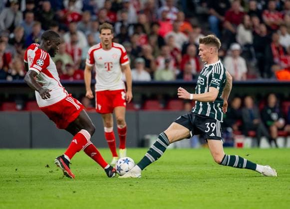 Fight for the ball duel between Dayot Upamecano FC Bayern Muenchen, 2 and Scott McTominay Manchester United FC, 39 GER, FC Bayern Muenchen vs Manchester United FC, Football, Champions League, Group Stage, Matchday 1, Season 2023 2024, 20 09 2023 DFL DFB REGULATES PROHIBIT ANY USE OF PHOTOGRAPHS as IMAGE SEQUENCES and or QUASI VIDEO GER, FC Bayern Muenchen vs Manchester United FC, football, Champions League, group stage, 1 match day, season 2023 2024, 20 09 2023 Muenchen Copyright: xEibner-Pressefoto HeikexFeinerx EP_HFR