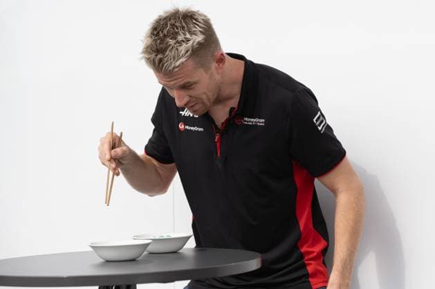 September 21, 2023, Suzuka, Mie Prefecture, Japan: NICO HULKENBERG (GER) of Haas F1 Team 27 recording a chopstick competition for a social media post during Preparation Day of the Formula 1 Lenovo Japanese Grand Prix. Suzuka Japan - ZUMAb177 20230921_aap_b177_062 Copyright: xTaidghxBarronx
