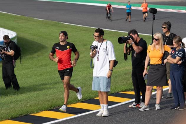 September 21, 2023, Suzuka, Mie Prefecture, Japan: CARLOS SANIZ (SPA) of Ferrari 55 arriving late to a meeting called by Sebastian Vettel...A Buzzin Corner bee hive bee hotel constructed as an initiative by former F1 World Champion Sebastian Vettel during Preparation Day of the Formula 1 Lenovo Japanese Grand Prix. Vettel called a meeting of all the 20 starting grid drivers at Turn 2 to personalize the bee hotels and draw media attention to environmental conservation efforts. Suzuka Japan - ZUMAb177 20230921_aap_b177_071 Copyright: xTaidghxBarronx