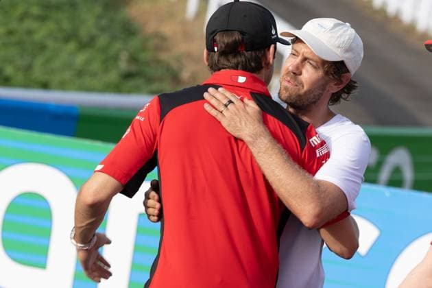 September 21, 2023, Suzuka, Mie Prefecture, Japan: CHARLES LECLERC (MON) of Ferrari 16 (red) greets SEBASTIAN VETTEL at Turn 2 for a meeting called by Sebastian Vettel...A Buzzin Corner bee hive bee hotel constructed as an initiative by former F1 World Champion Sebastian Vettel during Preparation Day of the Formula 1 Lenovo Japanese Grand Prix. Vettel called a meeting of all the 20 starting grid drivers at Turn 2 to personalize the bee hotels and draw media attention to environmental conservation efforts. Suzuka Japan - ZUMAb177 20230921_aap_b177_103 Copyright: xTaidghxBarronx