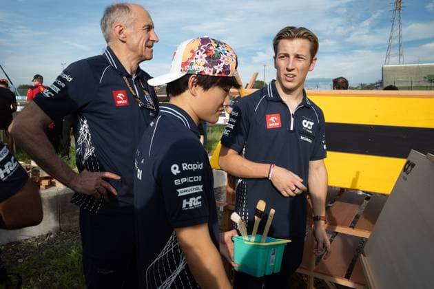 September 21, 2023, Suzuka, Mie Prefecture, Japan: FRANZ TOST observes YUKI TSUNODA (JAP) of AlphaTauri 22 and LIAM LAWSON (NZL) of AlphaTauri 15 painting a bee hotel...A Buzzin Corner bee hive bee hotel constructed as an initiative by former F1 World Champion Sebastian Vettel during Preparation Day of the Formula 1 Lenovo Japanese Grand Prix. Vettel called a meeting of all the 20 starting grid drivers at Turn 2 to personalize the bee hotels and draw media attention to environmental conservation efforts. Suzuka Japan - ZUMAb177 20230921_aap_b177_112 Copyright: xTaidghxBarronx