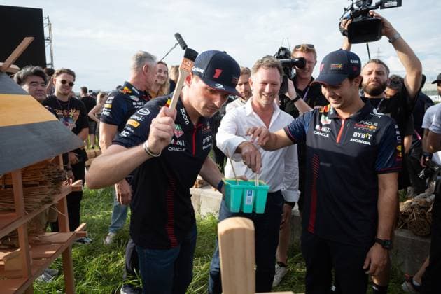 September 21, 2023, Suzuka, Mie Prefecture, Japan: MAX VERSTAPPEN (NED) of Red Bull Racing 1, CHRISTAIN HORNER and SERGIO PEREZ (MEX) of Red Bull Racing 11 painting a bee hotel...A Buzzin Corner bee hive bee hotel constructed as an initiative by former F1 World Champion Sebastian Vettel during Preparation Day of the Formula 1 Lenovo Japanese Grand Prix. Vettel called a meeting of all the 20 starting grid drivers at Turn 2 to personalize the bee hotels and draw media attention to environmental conservation efforts. Suzuka Japan - ZUMAb177 20230921_aap_b177_134 Copyright: xTaidghxBarronx