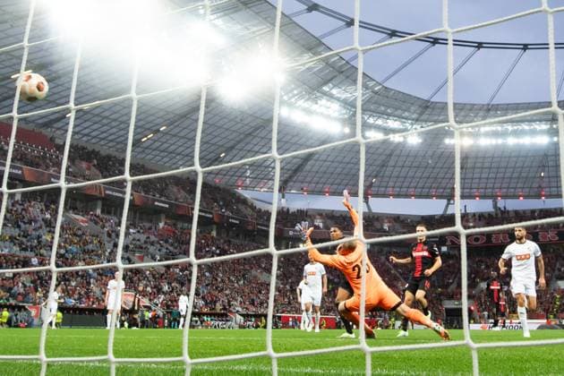 230921 Amine Adli of Bayer Leverkusen scores 2 0 behind goalkeeper Peter Abrahamsson of Häcken during the UEFA Europa League football match between Bayer Leverkusen and Häcken on September 21, 2023 in Leverkusen Photo Daniel Stiller BILDBYRAN code DS DS0334 football soccer football uefa europa league bayer leverkusen häcken bbeng  Copyright: DANIELxSTILLER BB230921DS022