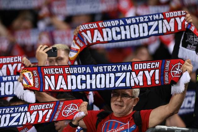Bergamo, Italy, 21st September 2023. Krakow fans hold aloft their scarves prior to kick off in the UEFA Champions League match at Stadio Di Bergamo, Bergamo. Picture credit should read: Jonathan Moscrop Sportimage EDITORIAL USE ONLY. No use with unauthorised audio, video, data, fixture lists, club league logos or live services. Online in-match use limited to 120 images, no video emulation. No use in betting, games or single club league player publications. SPI-2574-0004
