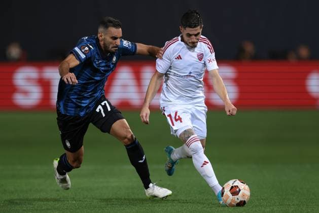Bergamo, Italy, 21st September 2023. Srdjan Plavsic of Krakow takes on Davide Zappacosta of Atalanta during the UEFA Champions League match at Stadio Di Bergamo, Bergamo. Picture credit should read: Jonathan Moscrop Sportimage EDITORIAL USE ONLY. No use with unauthorised audio, video, data, fixture lists, club league logos or live services. Online in-match use limited to 120 images, no video emulation. No use in betting, games or single club league player publications. SPI-2574-0011