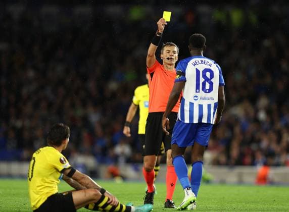 Brighton and Hove, England, 21st September 2023. Danny Welbeck of Brighton and Hove Albion is shown a yellow card during the UEFA Europa League match at the AMEX Stadium, Brighton and Hove. Picture credit should read: Paul Terry Sportimage EDITORIAL USE ONLY. No use with unauthorised audio, video, data, fixture lists, club league logos or live services. Online in-match use limited to 120 images, no video emulation. No use in betting, games or single club league player publications. SPI-2581-0037