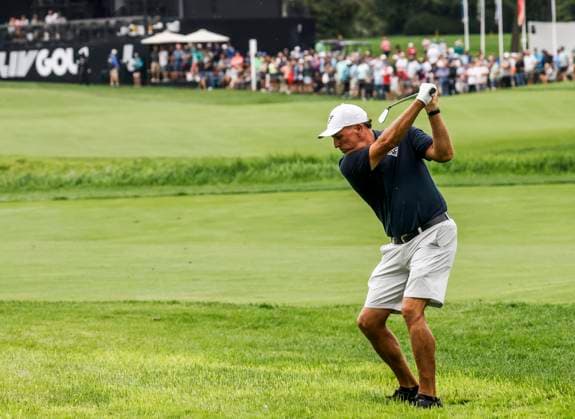 Phil Mickelson of the US hits from the rough on the eighteenth hole during the first round of the 2023 LIV Golf League tournament at Rich Harvest Farms in Sugar Grove, Illinois, on Friday September 22, 2023. Tournament play runs from September 22nd through the 24th.  SGI20230922849 TANNENxMAURY