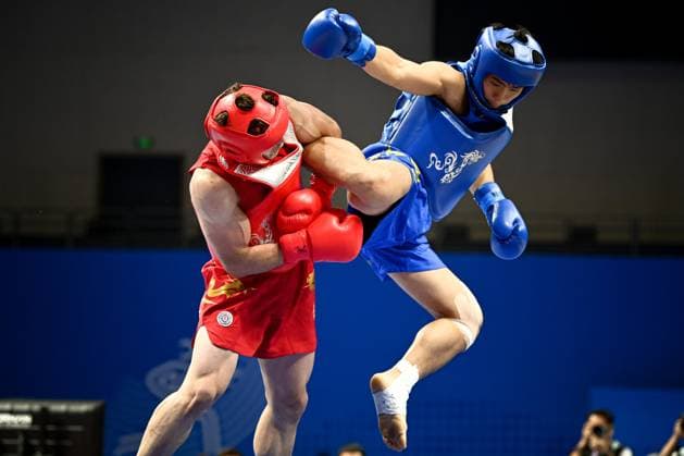 Sport Themen der Woche KW39 Sport Bilder des Tages (230928) -- HANGZHOU, Sept. 28, 2023 -- Yousef Sabriabibegloo (L) of Iran competes with Cai Feilong of China s Macao during the Men s 75kg Final of Wushu at the 19th Asian Games in Hangzhou, east China s Zhejiang Province, Sept. 28, 2023. ) (SP)CHINA-HANGZHOU-ASIAN GAMES-WUSHU (CN) JiangxHan 