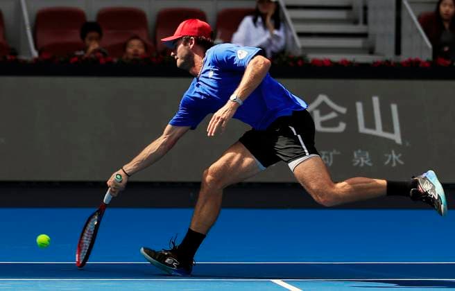 (230929) -- BEIJING, Sept. 29, 2023 -- Tommy Paul of the United States hits a return to Daniil Medvedev during the men s singles first round match at 2023 China Open tennis tournament in Beijing, capital of China, Sept. 29, 2023. ) (SP)CHINA-BEIJING-TENNIS-CHINA OPEN-MEN S SINGLES-1ST ROUND(CN) LuoxYuan 