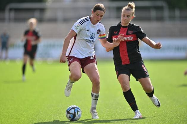 Zweikampf, Spielzene, Duell, duel, tackle, tackling, Dynamik, Action, Lara Schmidt 1 FC Nürnberg, 27 Nikola Karczewska B04, 9 , 30 09 2023, Leverkusen Germany , Fussball,google pixel Frauenbundesliga bayer 04 Leverkusen 1 FC Nürnberg, DFB DFL REGULATIONS PROHIBIT ANY USE OF PHOTOGRAPHS AS IMAGE SEQUENCES AND OR QUASI VIDEO xmkx