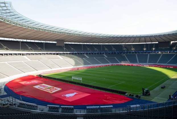 Football, men, season 2023 2024, Champions League Group C, 2 match day , 1 FC Union Berlin SC Braga, 1 day before the game, the Olympic Stadium is wrapped in the red and white club colors of Union, in the picture logo of Union and the Champions League and picture of the cup inside, 02 10 2023, Copyright: xSebastianxRäppold MatthiasxKochx