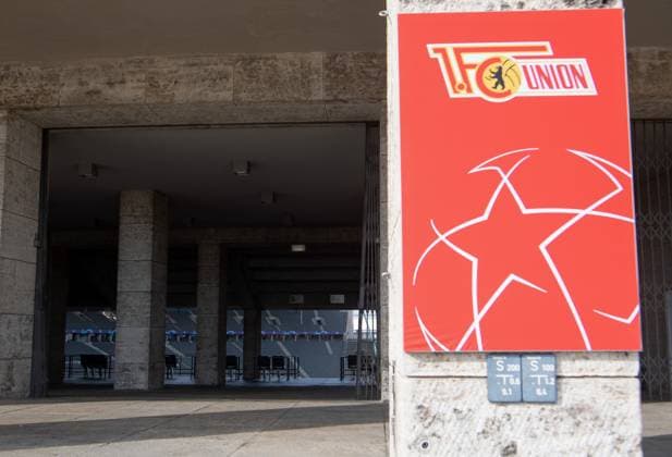 Football, men, season 2023 2024, Champions League Group C, 2 match day , 1 FC Union Berlin SC Braga, 1 day before the game, the Olympic Stadium is wrapped in the red and white club colors of Union, in the picture signs at the entrance to the East Curve, 02 10 2023, Copyright: xSebastianxRäppold MatthiasxKochx