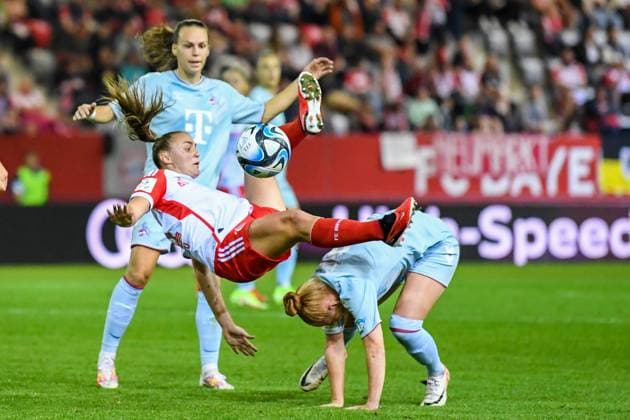 Womens soccer foul by STANWAY Georgia on VOGT Laura during the Google Pixel womens soccer Bundesliga match between FC Bayern Munich and 1 FC Köln on 02 10 2023, Germany, Bayern Munich FC Bayern Campus Bayern Germany
