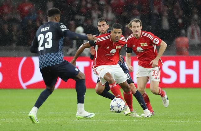 Simon Banza, Danilho Doekhi, Alex Kral duel match scene action sports football soccer UEFA Champions League UCL men 2 matchday season 2023 2024 03 10 2023 1 FC Union Berlin FCU vs SC Braga Olympiastadion DFL regulations prohibit any use of photographs as image sequences and or quasi video
