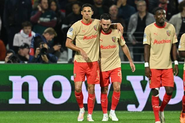 231003 RC Lens vs Arsenal Adrien Thomasson (28) of RC Lens celebrates with Florian Sotoca (7) of RC Lens after scoring the 1-1 equalizer goal during the Uefa Champions League matchday 2 game in group B in the 2023-2024 season between Racing Club de Lens and Arsenal FC on October 3 , 2023 in Lens, France. (Photo by David Catry Isosport) LENS FRANCE  Copyright: xx 408508