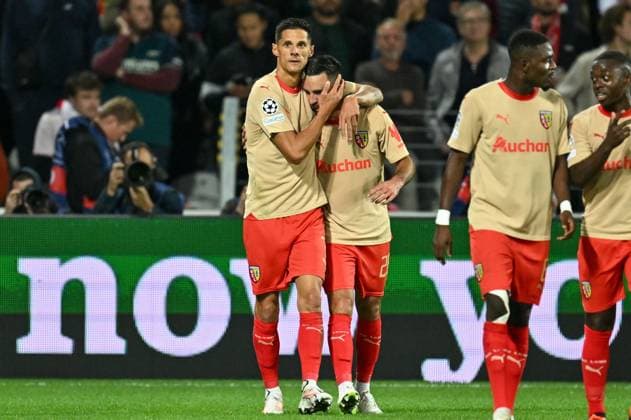 231003 RC Lens vs Arsenal Adrien Thomasson (28) of RC Lens celebrates with Florian Sotoca (7) of RC Lens after scoring the 1-1 equalizer goal during the Uefa Champions League matchday 2 game in group B in the 2023-2024 season between Racing Club de Lens and Arsenal FC on October 3 , 2023 in Lens, France. (Photo by David Catry Isosport) LENS FRANCE  Copyright: xx 408518