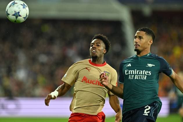 231003 RC Lens vs Arsenal Elye Wahi (9) of RC Lens fighting for the ball with William Saliba (2) of Arsenal during the Uefa Champions League matchday 2 game in group B in the 2023-2024 season between Racing Club de Lens and Arsenal FC on October 3 , 2023 in Lens, France. (Photo by David Catry Isosport) LENS FRANCE  Copyright: xx 408578