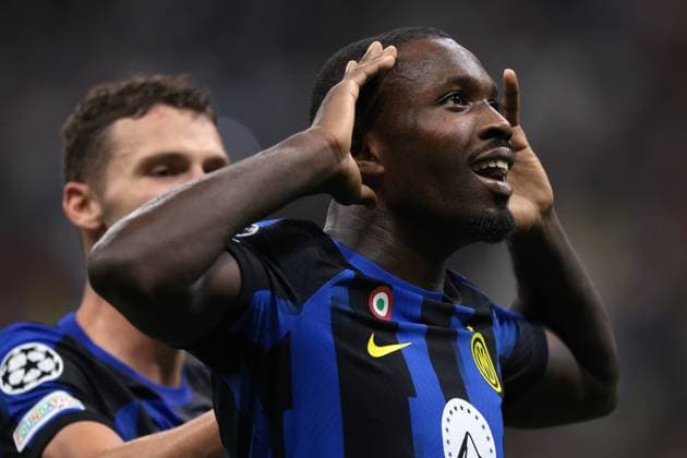 Milan, Italy, 3rd October 2023. Marcus Thuram of FC Internazionale celebrates with team mate Benjamin Pavard after scoring to give the side a 1-0 lead during the UEFA Champions League match at Giuseppe Meazza, Milan. Picture credit should read: Jonathan Moscrop Sportimage EDITORIAL USE ONLY. No use with unauthorised audio, video, data, fixture lists, club league logos or live services. Online in-match use limited to 120 images, no video emulation. No use in betting, games or single club league player publications. SPI-2603-0022