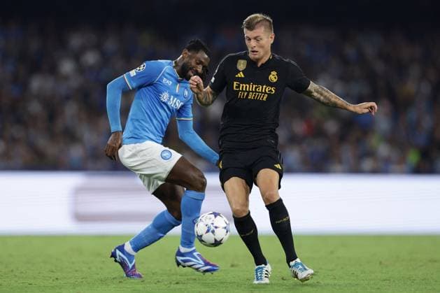 UEFA Champions League football match - SSC Napoli vs Real Madrid FC SSC Napoli s Cameroonian midfielder Andre Zambo Anguissa challenges for the ball with Real Madrid s German midfielder Toni Kroos during the Uefa champions league match between SSC Napoli vs Real Madrid at the Diego Armando Maradona Stadium in Naples, southern Italy, on October 03, 2023. Naples Italy  Copyright: xIPAxSport ABACAx BRIPASport20231003_424 IPAxSport ABACAx BRIPASport20231003_424