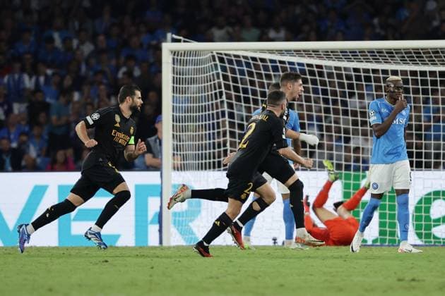 Federico Valverde of Real Madrid CF celebrates with team mates after scoring the goal of 2-3 during the Champions League Group C football match between SSC Napoli and Real Madrid FC at Diego Armando Maradona stadium in Naples (Italy), October 3rd, 2023. cesarexpurini