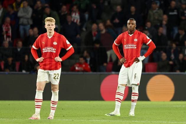 EINDHOVEN, 03-10-2023, Philips Stadium, UEFA Champions League season 2023 2024 match between PSV and Sevilla. (L-R) PSV player Jerdy Schouten, PSV player Armel Bella-Kotchap disappointed after 1-2 PSV - Sevilla  x22614287x Copyright: