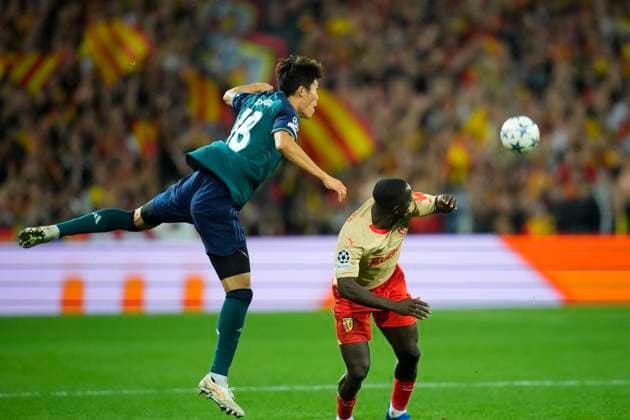 October 3, 2023, Lens, France: DEIVER MACHADO and TAKEHIRO TOMIYASU fights for the ball in the air during the Champions League pool game between Lens and Arsenal at Stade Felix Bollaert on October 3, 2023 in Lens, France. Lens France - ZUMAg253 20231003_zip_g253_065 Copyright: xGlennxGervotx