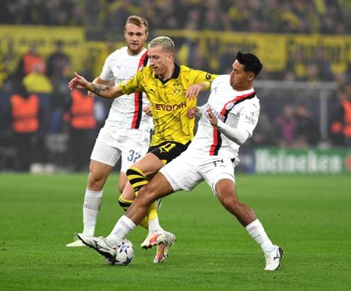 04 10 2023, Dortmund, Germany, Signal Iduna Park, Borussia Dortmund vs AC Milan UEFA Champions League 2023 2024 Group F, Marco Reus Borussia Dortmund and Tijjani Reijnders AC Milan in duel Photo Ralf Treese Dortmund Signal Iduna Park North Rhine Westphalia Germany 521_BVBACM20231004_008 Treese-521
