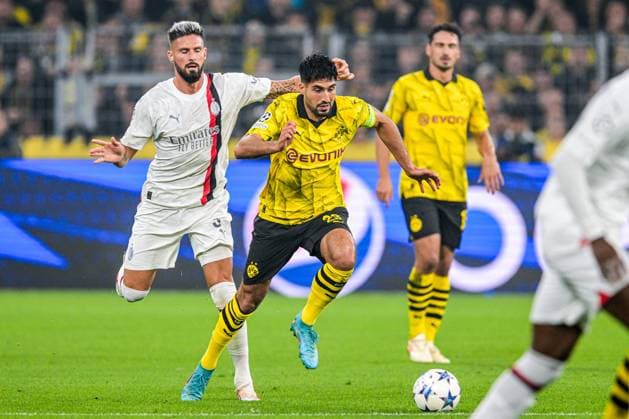DORTMUND - (l-r) Olivier Giroud of AC Milan, Emre Can of Borussia Dortmund during the UEFA Champions League match between Borussia Dortmund and AC Milan at Signal Iduna Park on October 4, 2023 in Dortmund, Germany. ANP Hollandse Hoogte UEFA Champions League 2023 24 2023 2024 xVIxANPxSportx xGerritxvanxKeulenxIVx 480239421 originalFilename: 480239421.jpg