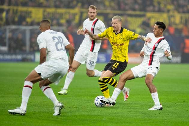 UEFA Champions League, Borussia Dortmund AC Milan, 04 10 2023 Marco Reus Borussia Dortmund, 11 in duel with Tijjani Reijnders AC Milan, 14 , UEFA Champions League, Borussia Dortmund AC Milan, 2 group match, on 4 10 2023, Signal Iduna Park, Dortmund UEFA regulations prohibit any use of photographs as image sequences and or quasi video Copyright: xBEAUTIFULxSPORTS Meuselx