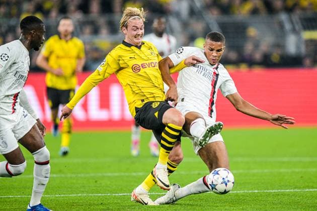 DORTMUND - (l-r) Julian Brandt of Borussia Dortmund, Malick Thiaw of AC Milan during the UEFA Champions League match between Borussia Dortmund and AC Milan at Signal Iduna Park on October 4, 2023 in Dortmund, Germany. ANP Hollandse Hoogte UEFA Champions League 2023 24 2023 2024 xVIxANPxSportx xGerritxvanxKeulenxIVx 480240558 originalFilename: 480240558.jpg