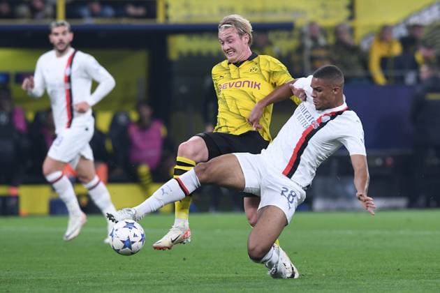 Soccer Champions group stage 2 matchday Borussia Dortmund AC Milan on 04 10 2023 at Signal Iduna Park in Dortmund Malick Thiaw Milan , front Julian Brandt Dortmund , rear xRx
