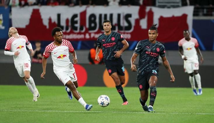 Lois Openda, Manuel Akanji duel match scene action sports football soccer UEFA Champions League UCL mens 2 matchday season 2023 2024 04 10 2023 Rasen Ballsport RB Leipzig RBL vs Manchester City DFL regulations prohibit any use of photographs as image sequences and or quasi video