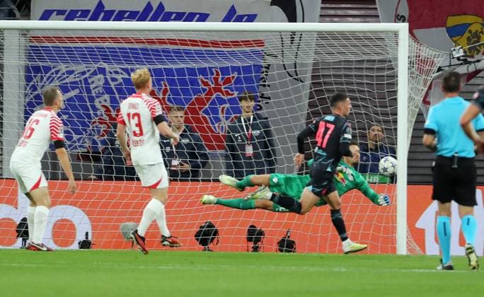 Phil Foden scores goal 0 1 against goalkeeper Janis Blaswich duel match scene action sports football soccer UEFA Champions League UCL men 2 matchday season 2023 2024 04 10 2023 Rasen Ballsport RB Leipzig RBL vs Manchester City DFL regulations prohibit any use of photographs as image sequences and or quasi video