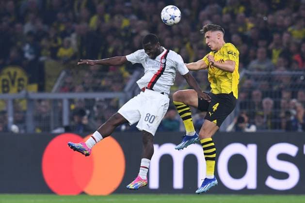 Soccer Champions Group Stage 2 Matchday Borussia Dortmund AC Milan on 04 10 2023 at Signal Iduna Park in Dortmund Yunus Musah Milan , left Nico Schlotterbeck Dortmund , right xRx