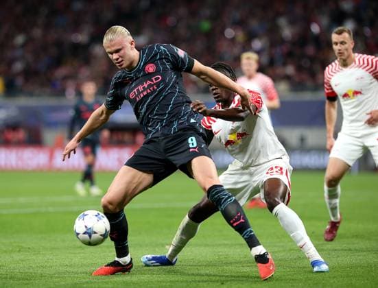 04 10 2023, Football UEFA Champions League 2023 2024, Group stage, Matchday 2, RB Leipzig Manchester City, at Red Bull Arena Leipzig L R Erling Haaland Manchester City vs Castello Lukeba RB Leipzig DFL and DFB regulations prohibit any use of photographs as image sequences and or quasi video